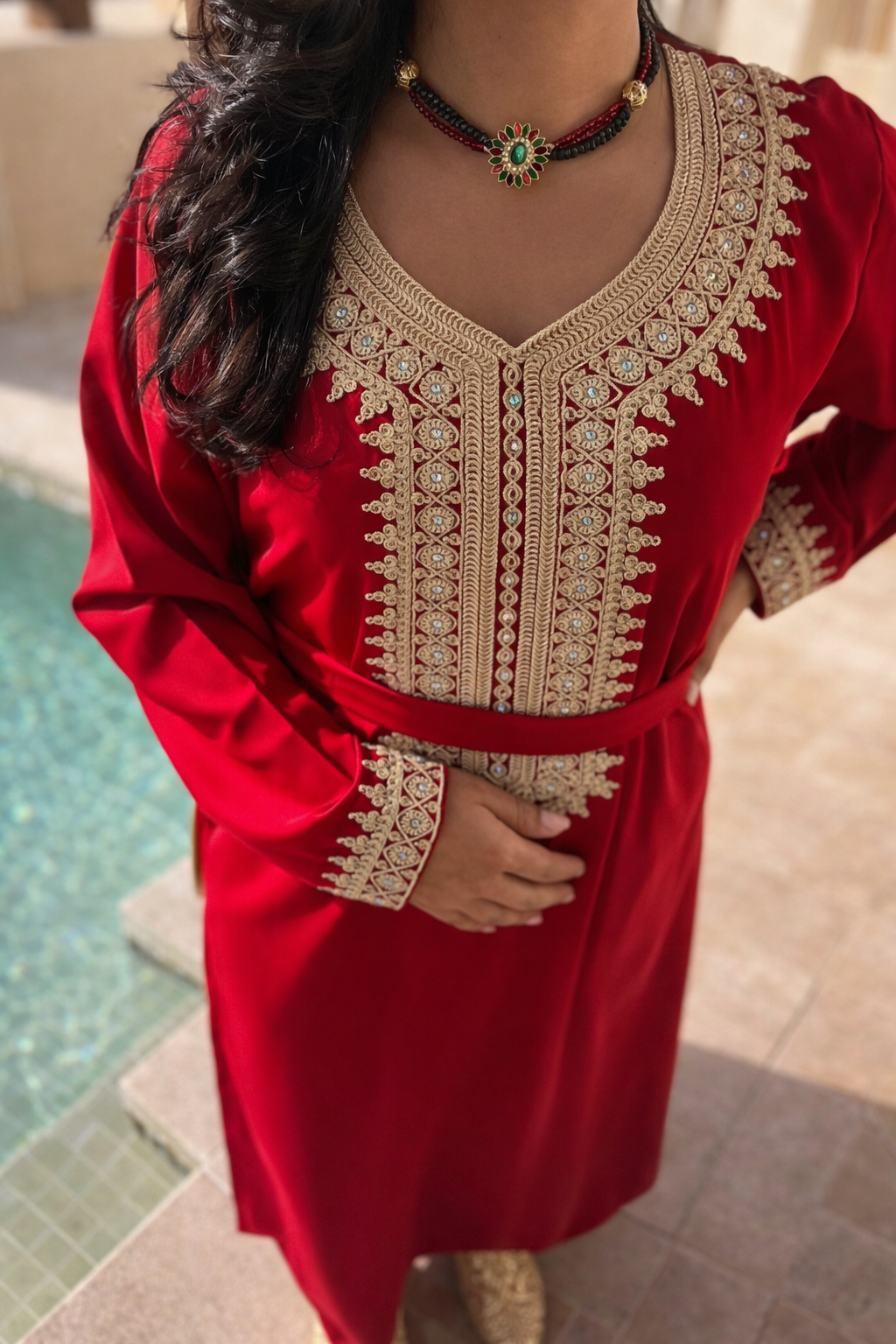 Focus on the refined textile featuring subtle woven vertical lines that add depth without weight. The wide butterfly sleeves are finished with meticulous gold motifs, ensuring every movement is met with effortless grace and a soft, shimmering glow.