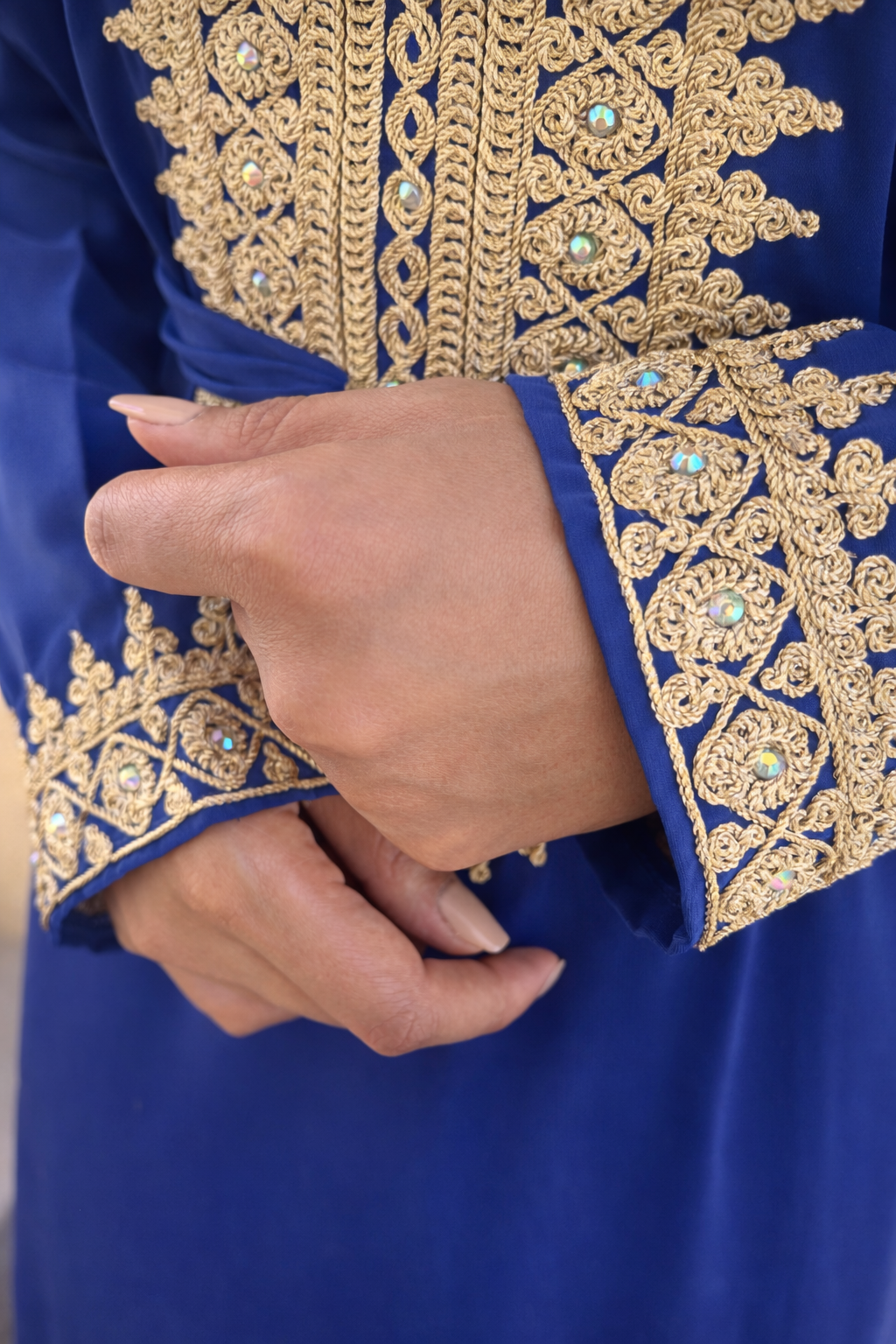 High-definition detail of the artisanal gold patterns and light-reflecting jewels on the Azure Serenity Kaftan.