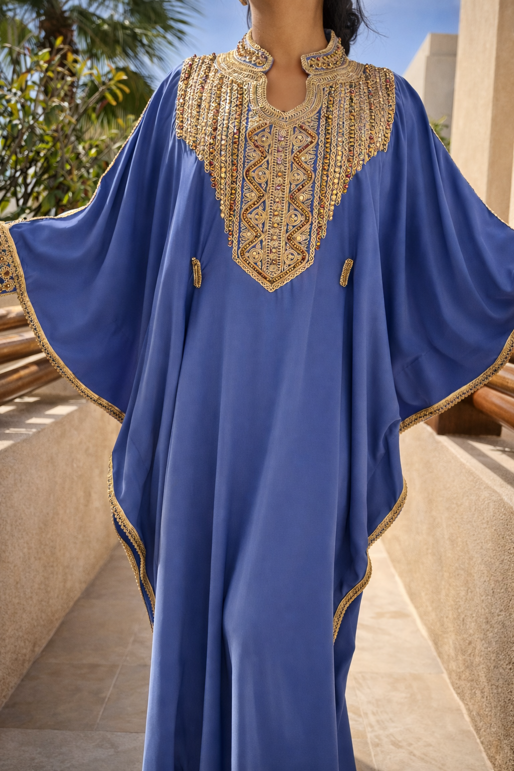 Full view of the Maison Nelya Azure Serenity Kaftan in sky blue with gold embroidery and butterfly sleeves.