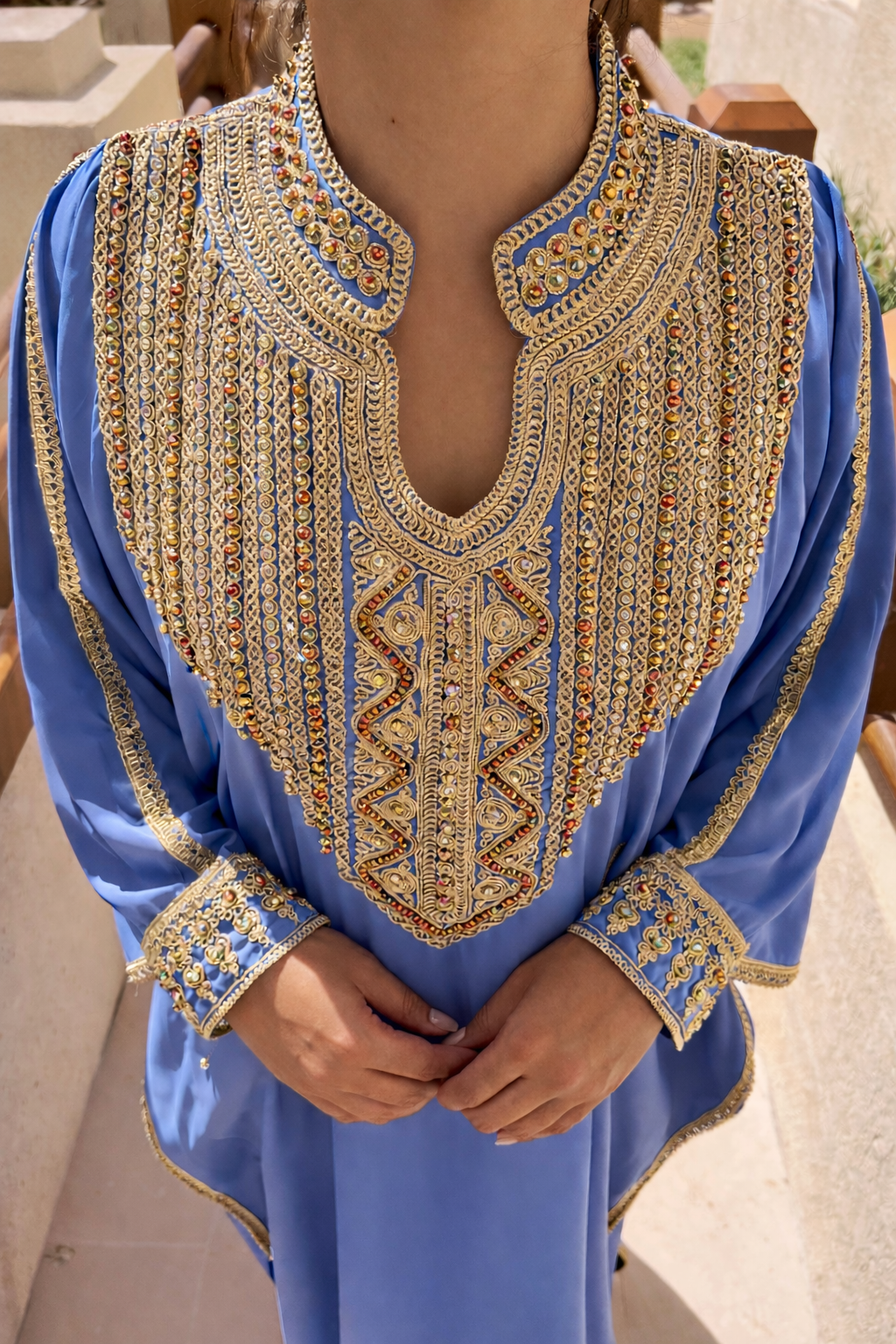 High-definition detail of the artisanal gold patterns and light-reflecting jewels on the Azure Serenity Kaftan.