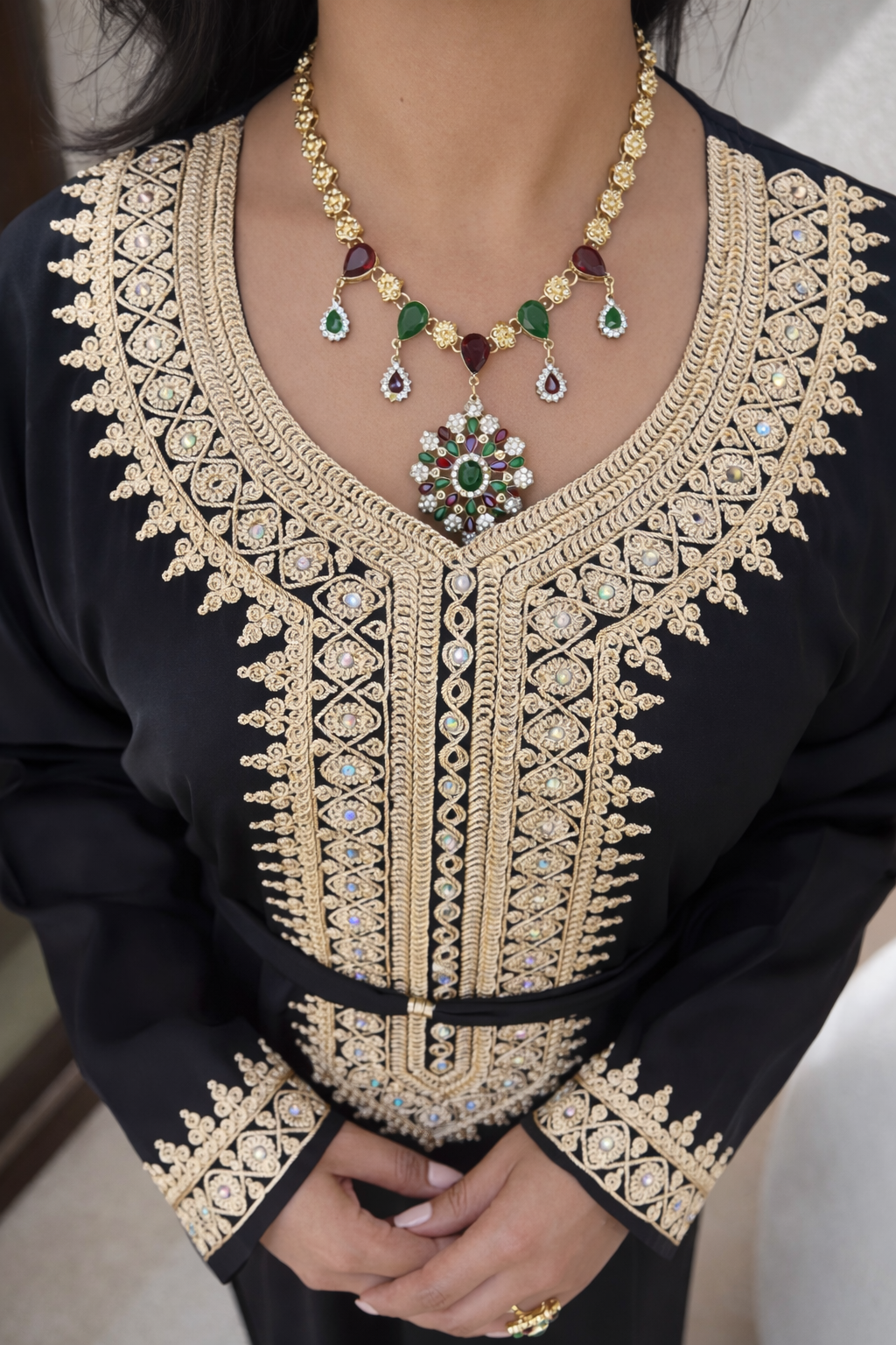 Close-up of the geometric gold motifs and traditional craftsmanship on the Midnight Heritage Kaftan.