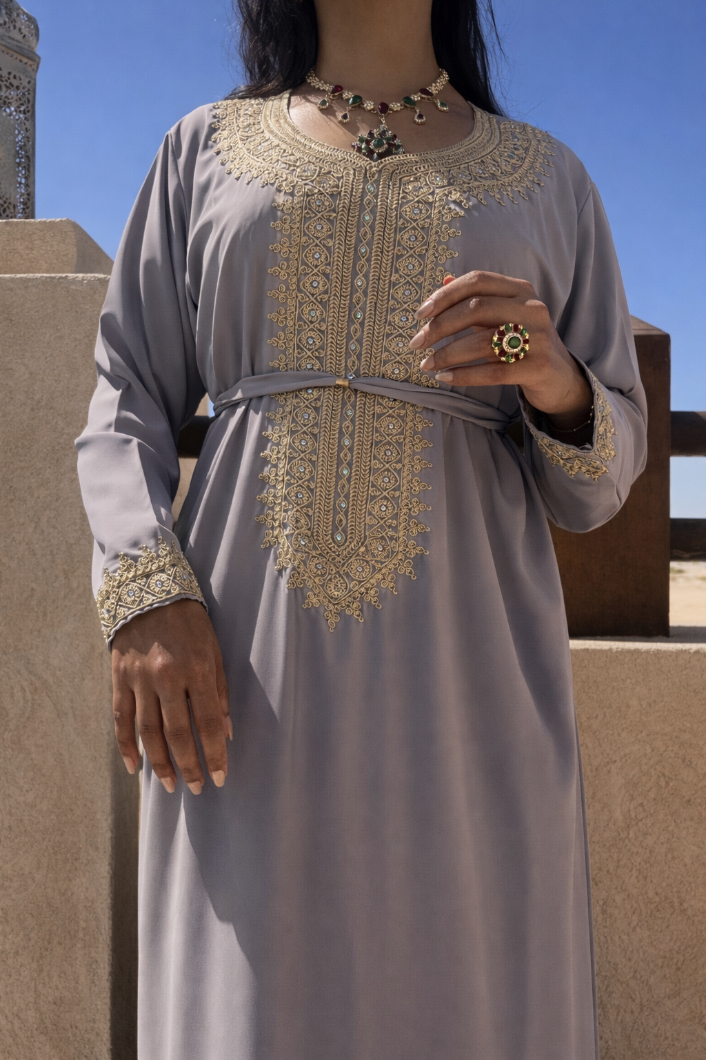 Full length view of the Maison Nelya Silver Veil Kaftan in ash-grey with gold embroidery.