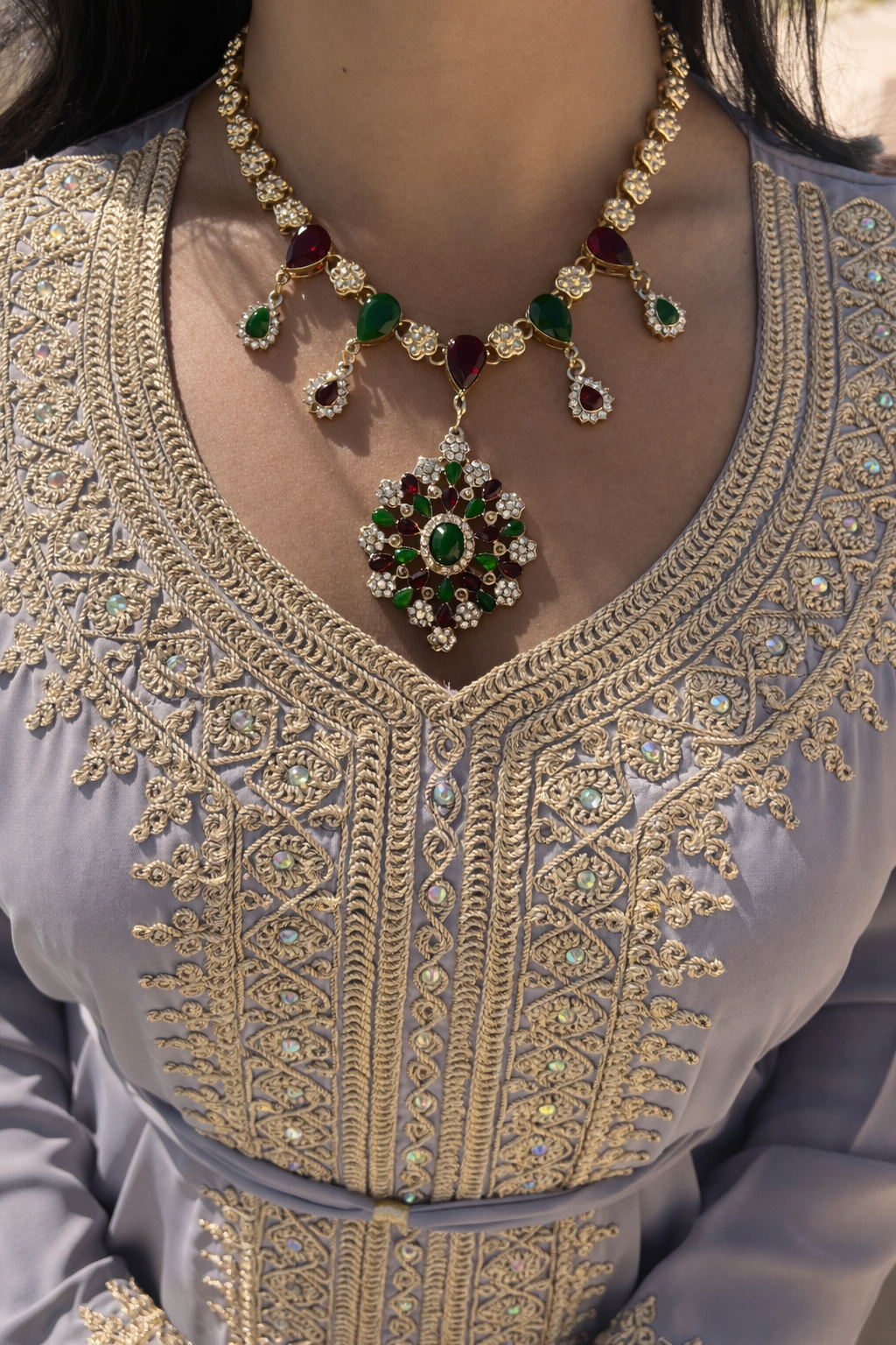 Close-up of the traditional Moroccan gold motifs and iridescent crystals on the ash-grey central panel.