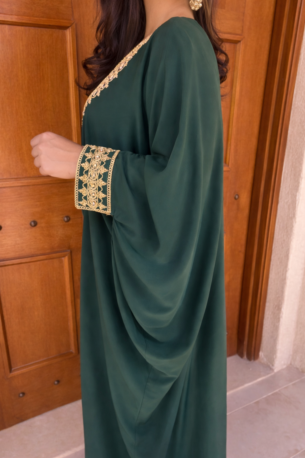 Close-up of the subtle gemstone embellishments and gold hand-embroidery on the Verdant Grace bodice.